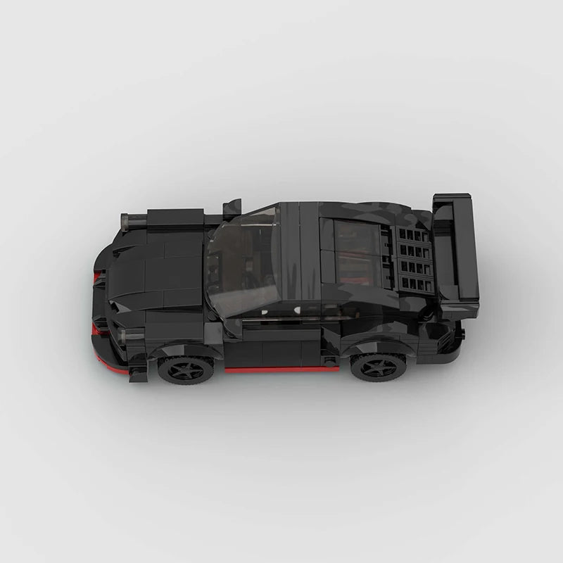 Black toy car built with MOC building blocks on a white background