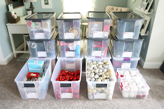Heavy-duty storage bins stacked neatly in a home garage, protecting seasonal kitchen appliances and holiday supplies