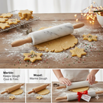 Marble rolling pin with wooden handles rolling out holiday cookie dough on a floured wooden table, showcasing the benefits of marble for festive baking.