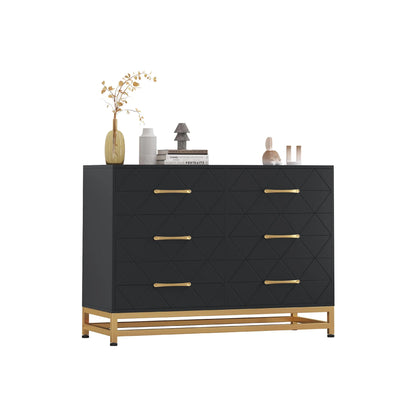 Black 6-drawer dresser with gold handles and metal base, geometric front design, styled with home decor accessories on top