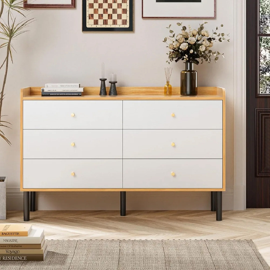 Front view of wooden dresser with six white drawers and black legs