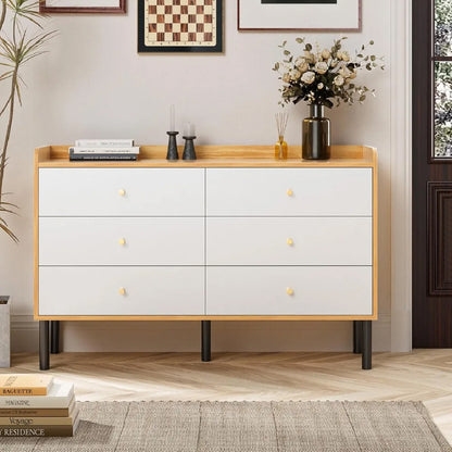 Front view of wooden dresser with six white drawers and black legs
